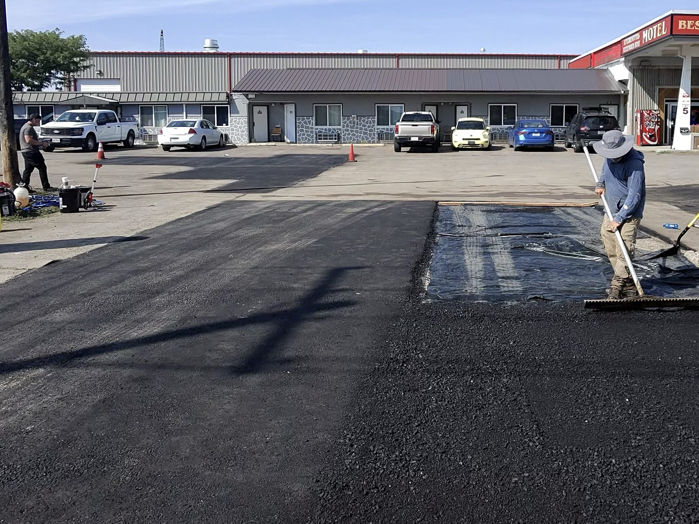 Asphalt repair patch in a commercial parking lot